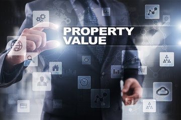 Businessman selecting property value on virtual screen.