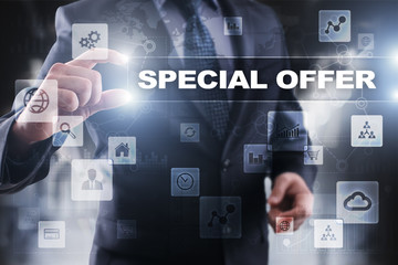 Businessman selecting special offer on virtual screen.