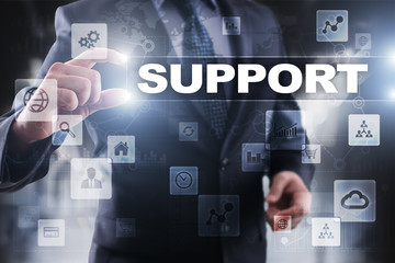 Businessman selecting support on virtual screen.