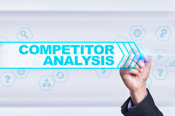 Businessman drawing on virtual screen. competitor analysis concept.
