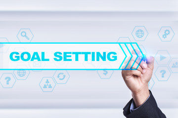 Businessman drawing on virtual screen. goal setting concept.
