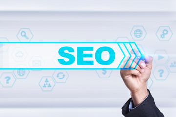 Businessman drawing on virtual screen. seo concept.