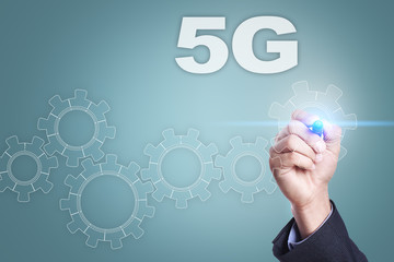 Fototapeta premium Businessman drawing on virtual screen. 5g concept