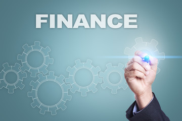 Businessman drawing on virtual screen. finance concept