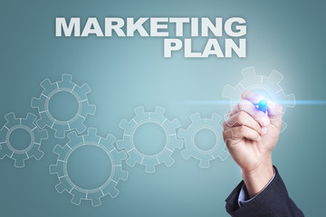 Businessman drawing on virtual screen. marketing plan concept