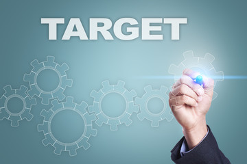 Businessman drawing on virtual screen. target concept