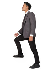 Ambitions concept with businessman climbing stairs