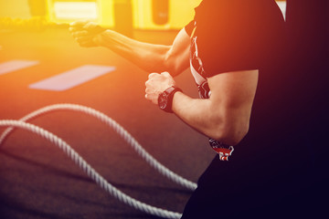 trainer with the clock marks the time in the gym for fitness. high contrast and monochrome color...