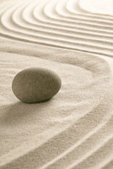 Fototapeta na wymiar stone on raked sand in Japanese zen garden.