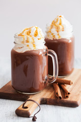 hot chocolate with whipped cream caramel in mason jar