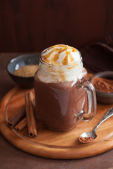 hot chocolate with whipped cream caramel in mason jar