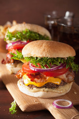 bacon cheese burger with beef patty, tomato and onion