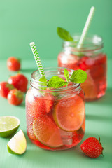 summer strawberry lemonade with lime and mint in jars