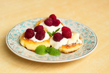 cottage cheese pancake with sour cream and raspberries