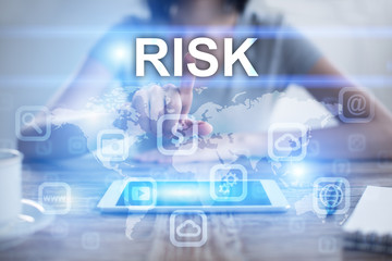 Woman using tablet pc, pressing on virtual screen and selecting risk