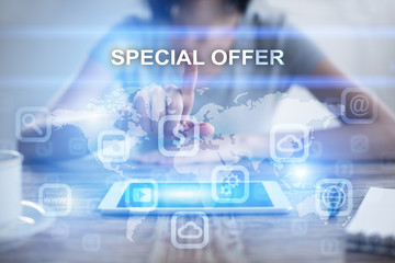 Woman using tablet pc, pressing on virtual screen and selecting special offer