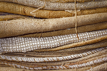 Empty old dirty jute sacks stacked