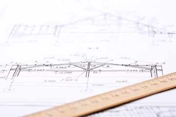 Workplace of architect. Architectural design, sketch, drawing paper, wooden ruler  close-up. Soft focus