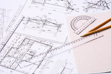 Workplace of architect. Architectural design, sketch, drawing paper, drawings, simple pencil, transparent ruler with protractor on the table
