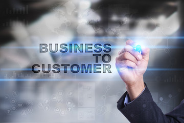 Businessman is drawing on virtual screen. business to customer concept.