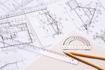 Workplace of architect. Architectural design, sketch, drawing paper, drawings, simple pencil, transparent ruler with protractor on the table
