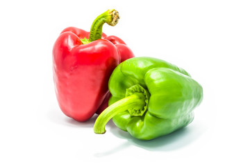 Red and green bell peper on white background.
