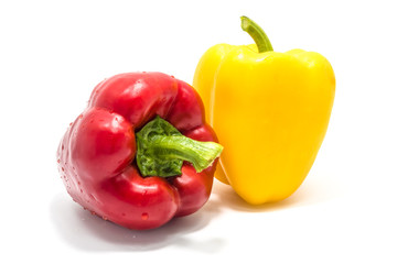 Yellow and red bell peper on white background.