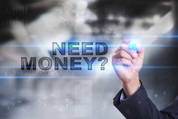 Businessman is drawing on virtual screen. need money concept.