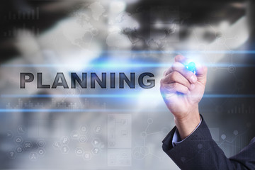 Businessman is drawing on virtual screen. planning concept.