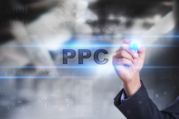 Businessman is drawing on virtual screen. ppc concept.