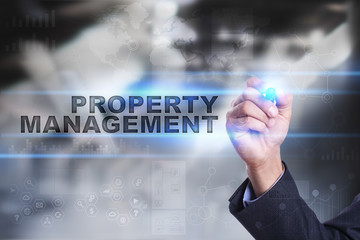 Businessman is drawing on virtual screen. property management concept.