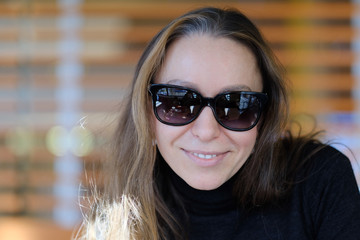 Portrait of a young woman in sunglasses