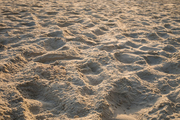 Close up sand crest on the beach at sunset with blurred background