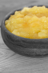 Homemade apple sauce in a wooden bowl