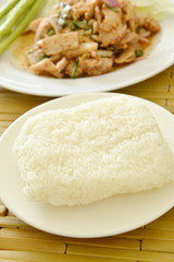 sticky rice eat couple with Thai spicy slice pork salad and fresh vegetable