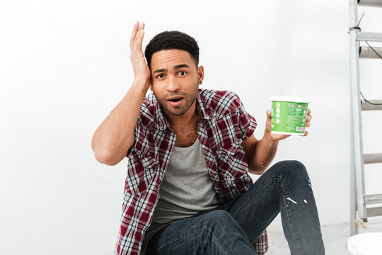 Upset man with dye in hands