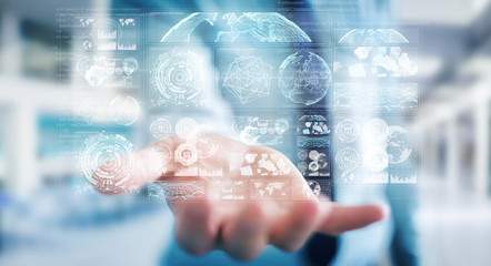 Businessman using digital screens with holograms datas 3D rendering