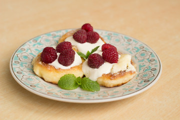 cottage cheese pancakes with sour cream and raspberries