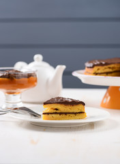 White faience teaware, low callorie pumpkin dessert and layered pumpkin cake with chocolate ganache