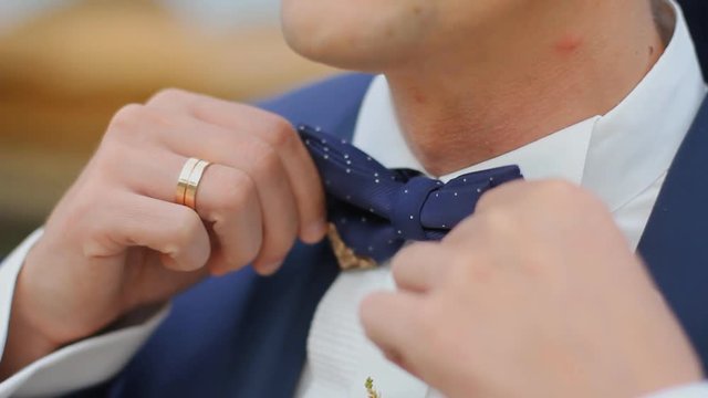 Groom shoes, bouquet, bow tie