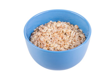 Oatmeal in a blue cup on a white background