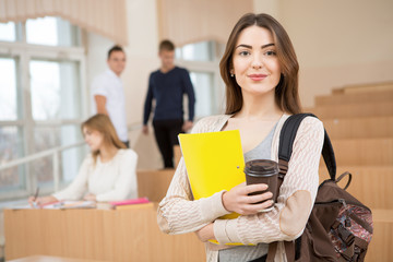 Attractive female student at university auditorium