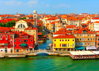 Fototapeta na wymiar Beautiful view from Grand Canal on colorful facades of old medieval houses in Venice, Italy