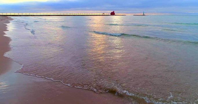 Beautiful waves lapping the sandy shores, gentile, eternal, ethereal.
