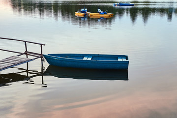 .Blue boat lake summer evening