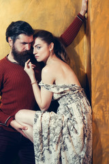 Pretty girl with closed eyes leaning on serious bearded man