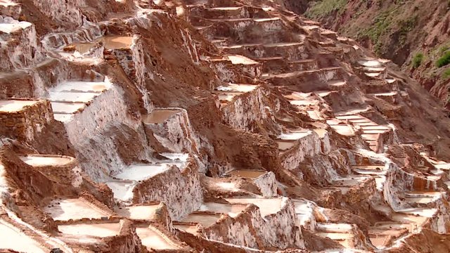 SALT MINING: video footage from Maras, Peru. Region of Cusco in andean landscape in South America, Peru.