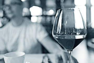 Serving a glass of red wine in a restaurant
