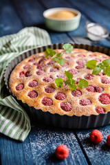 Juicy raspberry pie with powdered sugar icing