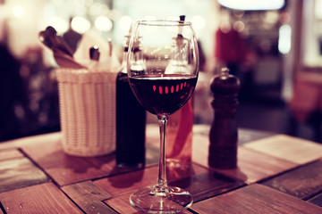 Serving a glass of red wine in a restaurant